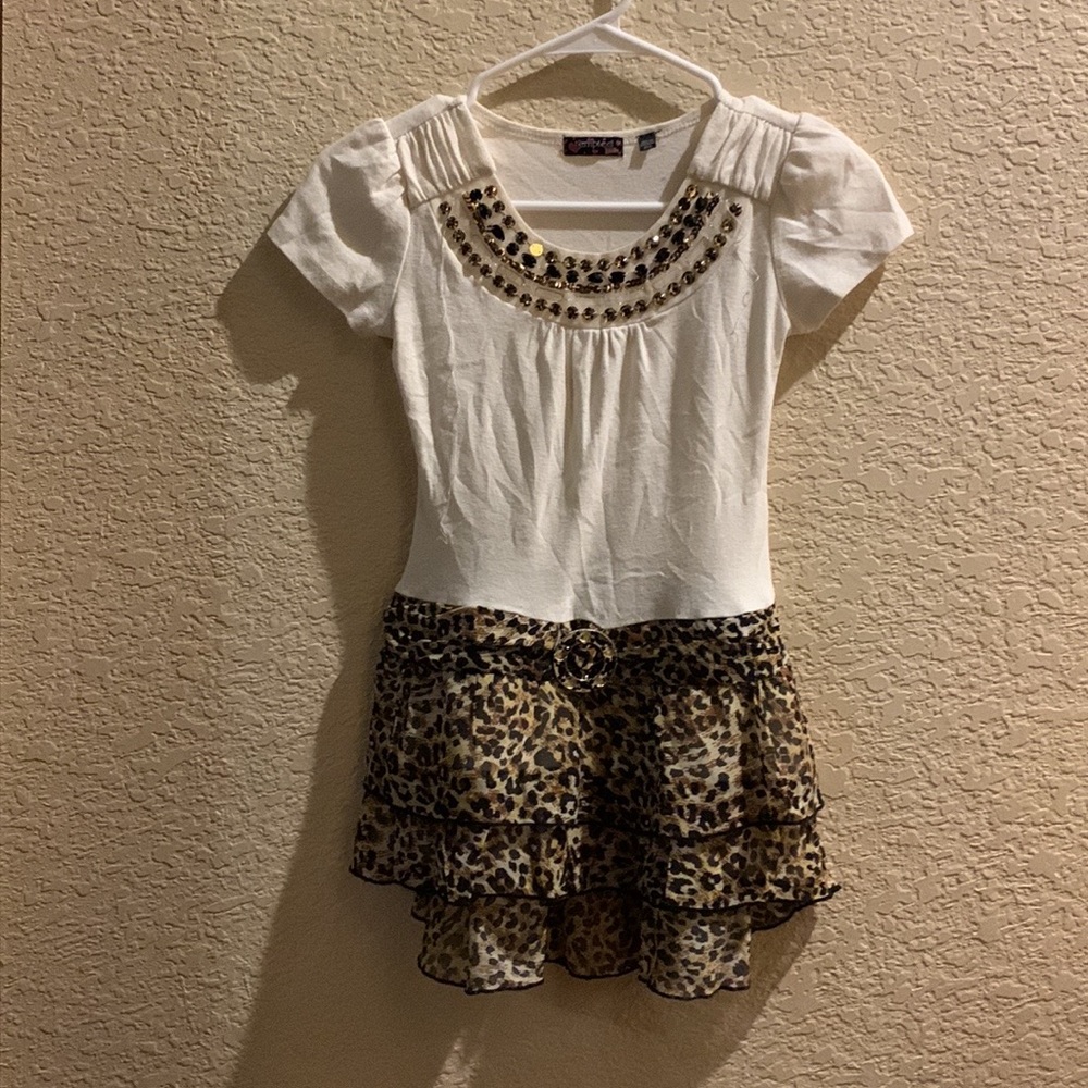 A cute top in the brand tempted girls